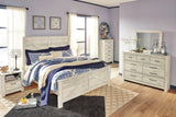 Bellaby Whitewash King Crossbuck Panel Bed styled in bedroom