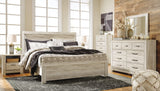 Bellaby Whitewash King Panel Bed styled in bedroom setting