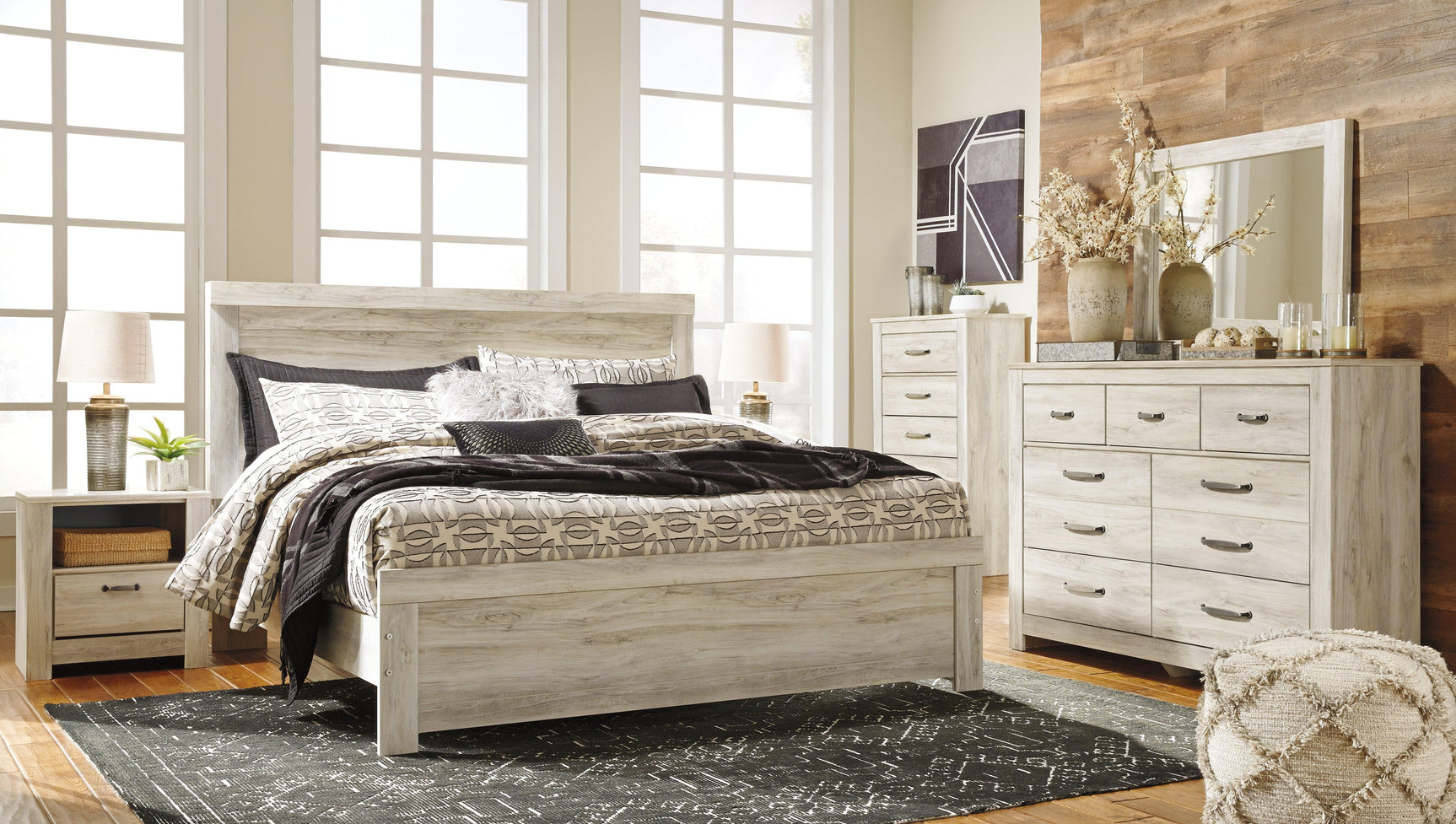 Bellaby Whitewash King Panel Bed styled in bedroom setting