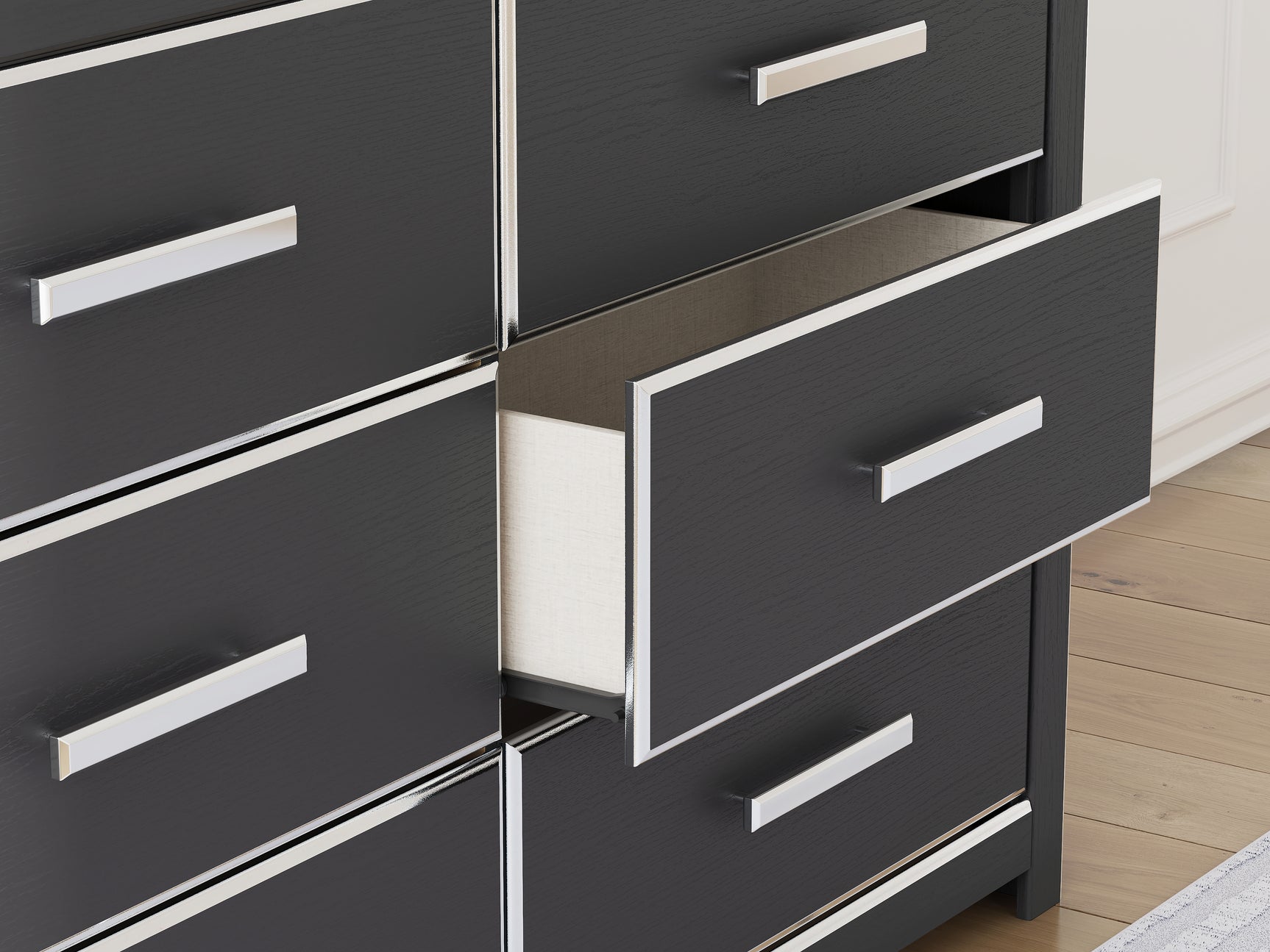 Detail of chrome-tone handle with faceted design on Zuraleus dresser