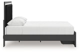 Side profile view of black upholstered panel bed
