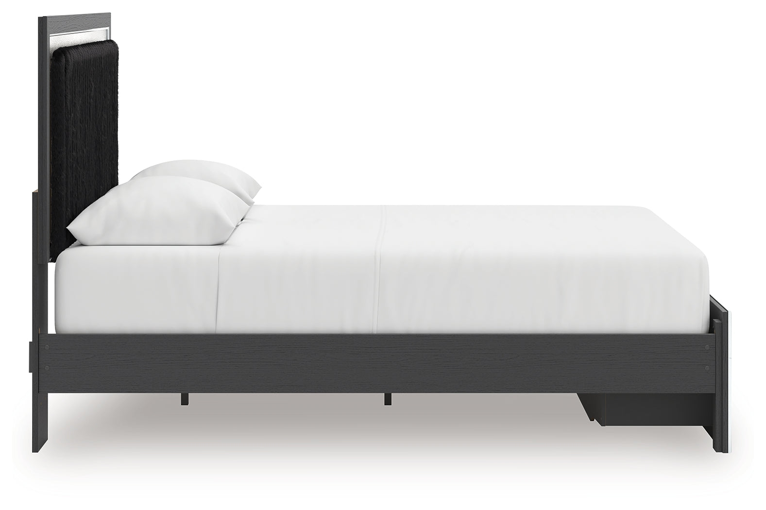 Side profile view of black upholstered panel bed