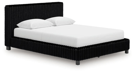 Zuraleus Black Queen Upholstered Panel Bed close-up of headboard