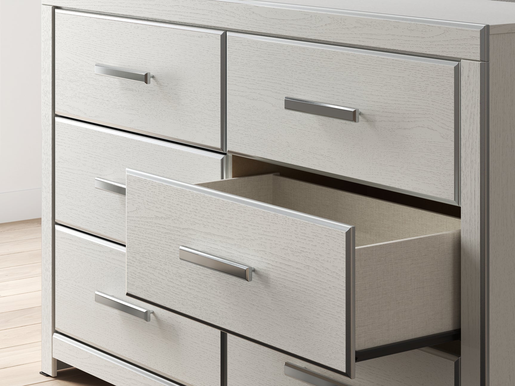Chrome-tone faceted drawer handle detail