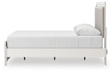 Headboard detail showing tufted upholstery