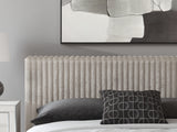 Close-up detail of upholstered headboard and fabric texture