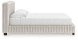 Side view of Zuraleus White King Upholstered Bed showing upholstery and frame