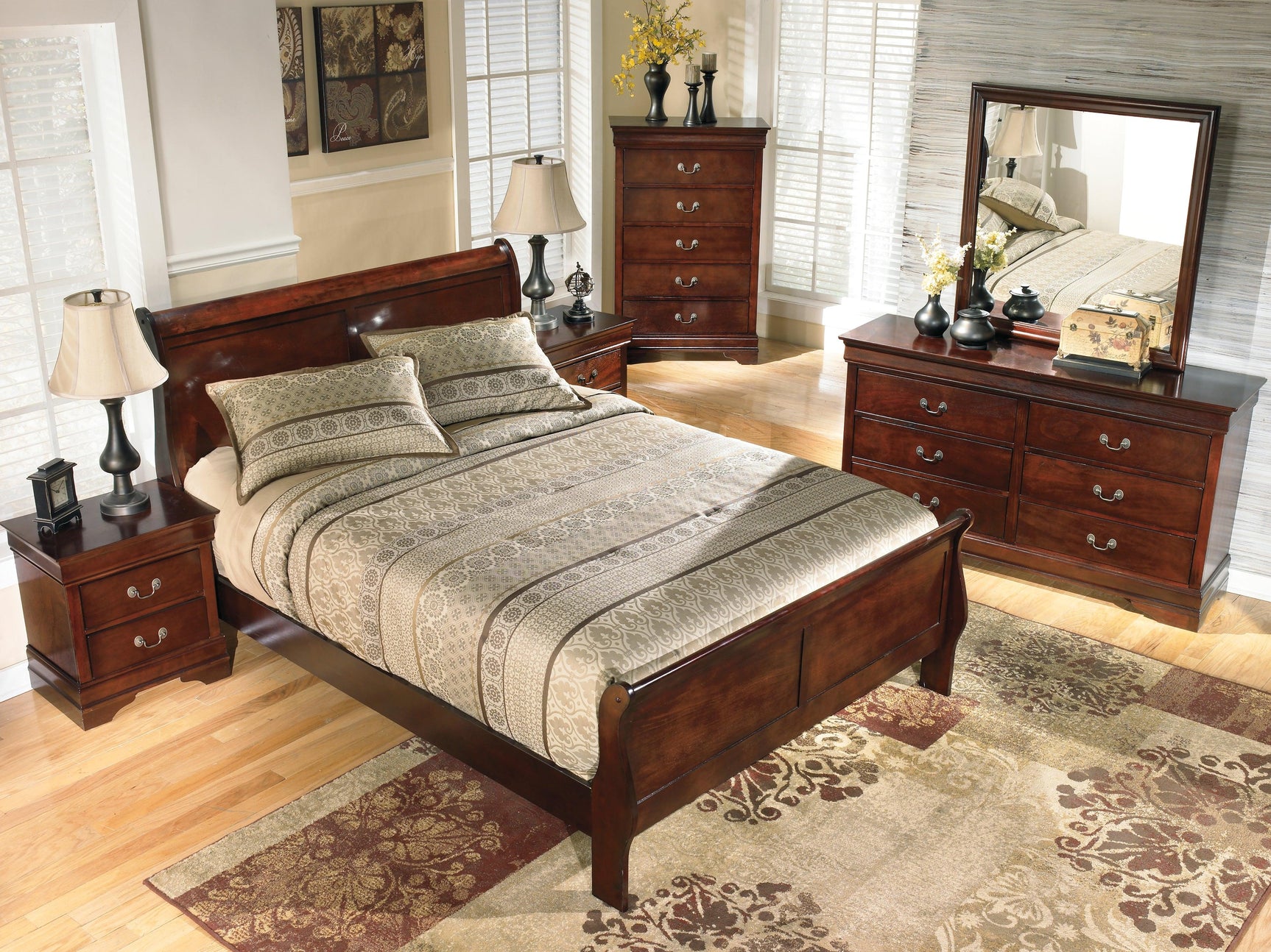 Close-up of dark brown finish and carved details on bed