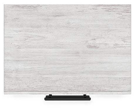 Top view of Cayboni Whitewash Nightstand showing surface texture
