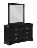 Louis Philip black dresser with multiple drawers in bedroom setting