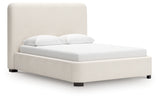 Brintstreet beige queen upholstered bed, side angle view