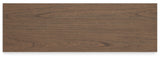 Detailed view of nickel-tone metal knobs on dresser