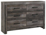 Wynnlow Gray Dresser angled view with visible hooded pulls