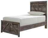 Wynnlow Gray Twin Crossbuck Panel Bed side angled view