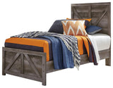 Close-up of Wynnlow Gray Twin Crossbuck headboard crossbuck design