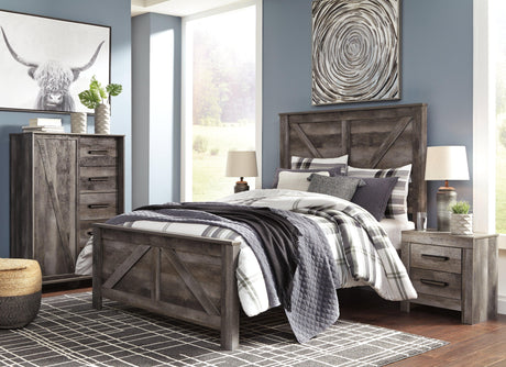Wynnlow Gray Queen Crossbuck Panel Bed assembled in bedroom setting