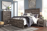 Wynnlow Gray King Crossbuck Panel Bed angled perspective