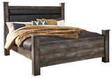 Wynnlow Gray King Poster Bed side angle showcasing rustic gray oak grain finish