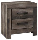 Side angle of Wynnlow Gray Nightstand highlighting weathered gray oak grain finish