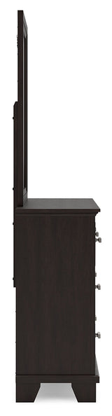 Close-up of bright nickel-tone metal bar pulls on Covetown dresser