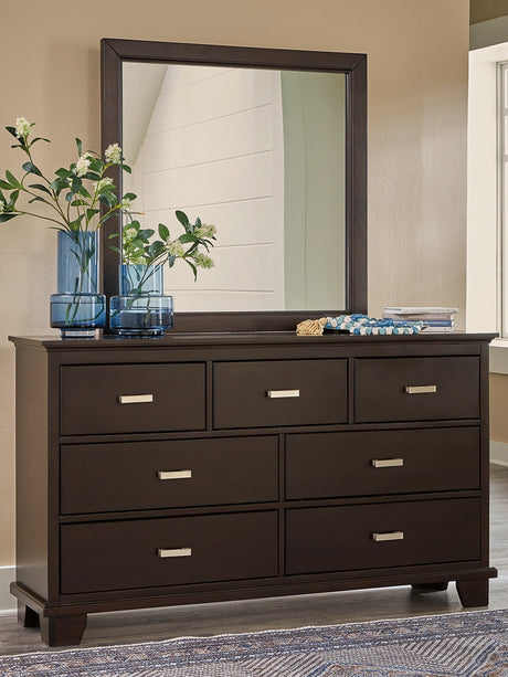Covetown dark brown dresser with attached mirror, angled side view