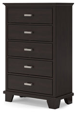 Close-up of bright nickel-tone metal bar pulls on dark brown chest