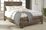 Trinell Brown Queen Panel Bed close-up of nailhead trim