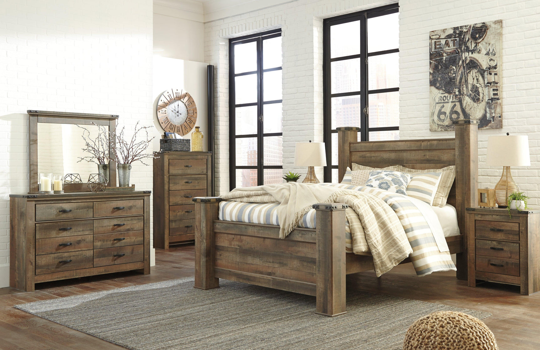 Poster bed posts with intricate details on Trinell Brown Queen Bed