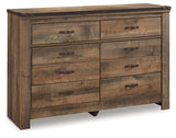 Rustic plank finish detail on Trinell Brown dresser