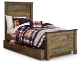 Close-up of Trinell bed rustic plank finish and nailhead accents