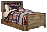 Trinell Brown Twin Bookcase Bed close-up showing rustic plank finish and nailhead accents