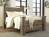 Detail of nailhead trim on Trinell Brown Queen Poster Bed posts