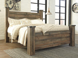 Close-up on Trinell bed's nailhead trim and wood grain texture