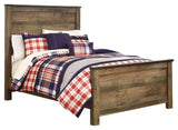 Detailed view of nailhead accents on Trinell Bed headboard