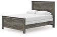 Frandern Queen Panel Bed, angled front view showing headboard and footboard