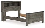 Side angle of Frandern Full Bookcase Panel Bed highlighting nailhead accents
