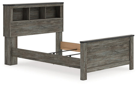 Side angle of Frandern Full Bookcase Panel Bed highlighting nailhead accents