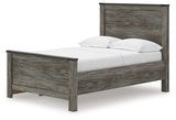 Close-up of faux metal detailing and nailhead accents on bed frame