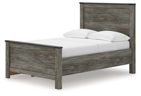 Close-up of faux metal detailing and nailhead accents on bed frame