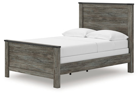 Close-up of Frandern bed's faux metal nailhead accents on headboard