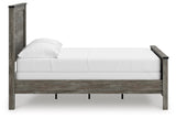 Angled view showing bed frame construction and finish quality