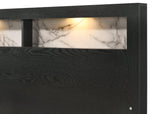 Bedroom view of king size bed from Cadence Black LED Bookcase bedroom set