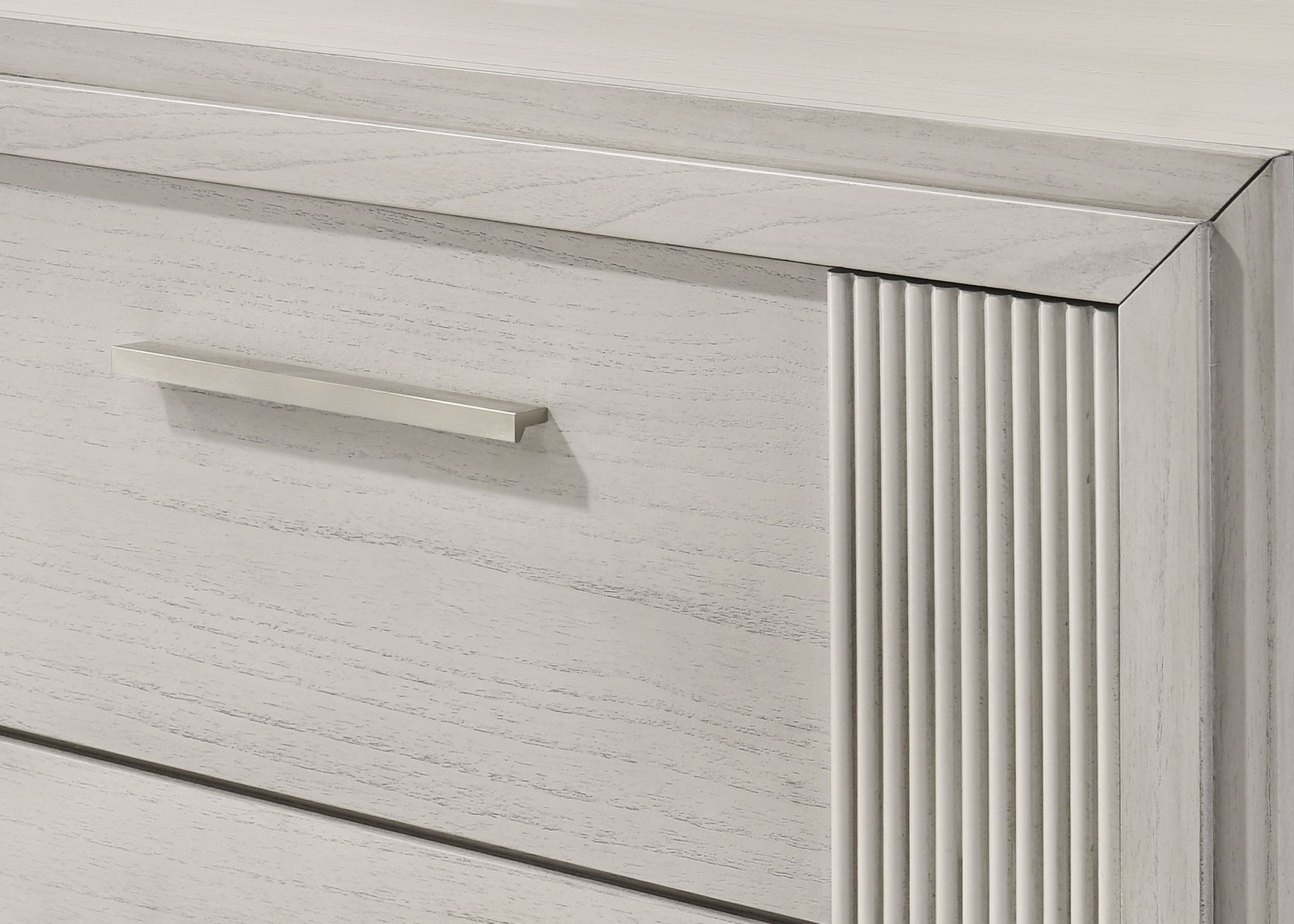 Bedroom view with bed and chest in Carlton White Upholstered Panel Bedroom Set