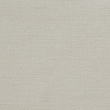 Close-up of woven neutral fabric upholstery on headboard