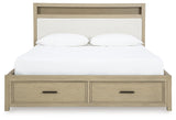 Open drawer in footboard showing storage space