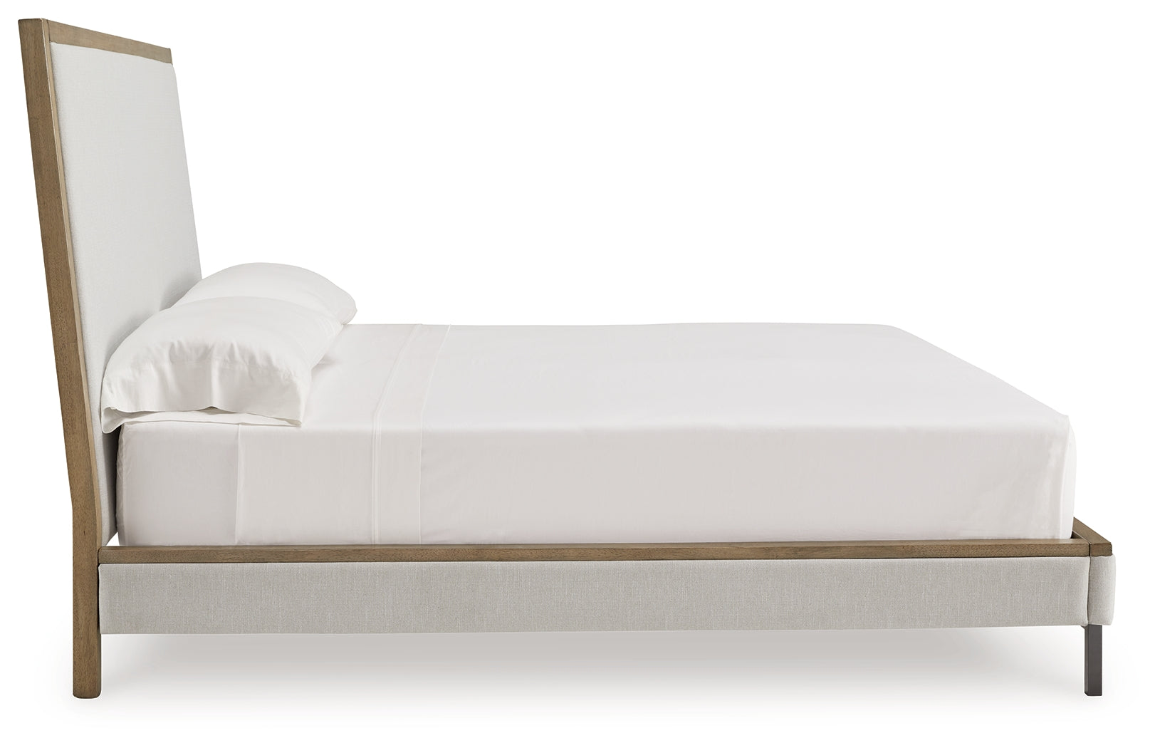 Side profile of Tomtyn Light Brown King Upholstered Bed