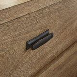 Close-up of metal bar drawer pulls on Tomtyn dresser