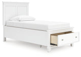 Opened storage drawer in footboard showing space