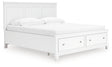 Storage drawers open on Fortman King Bed footboard