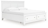 Storage drawers open on Fortman King Bed footboard